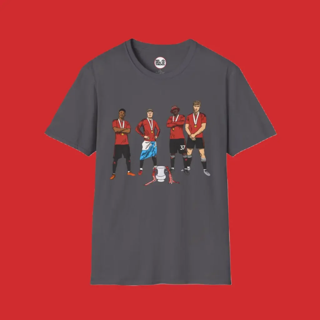 Full-length charcoal T-shirt featuring animated images of Amad, Garnacho, Mainoo, and Hojlund celebrating Manchester United’s FA Cup victory.
