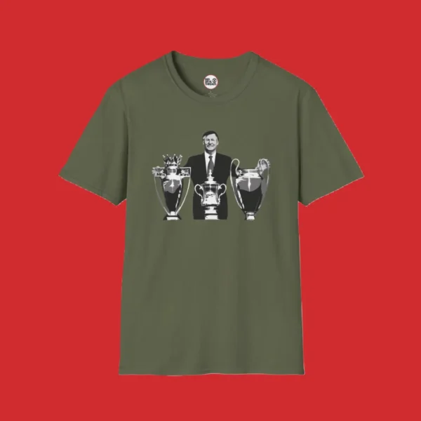 Full-length green T-shirt featuring image of Sir Alex Ferguson and his amazing achievement of winning the treble in 1999 as Manchester United manager.