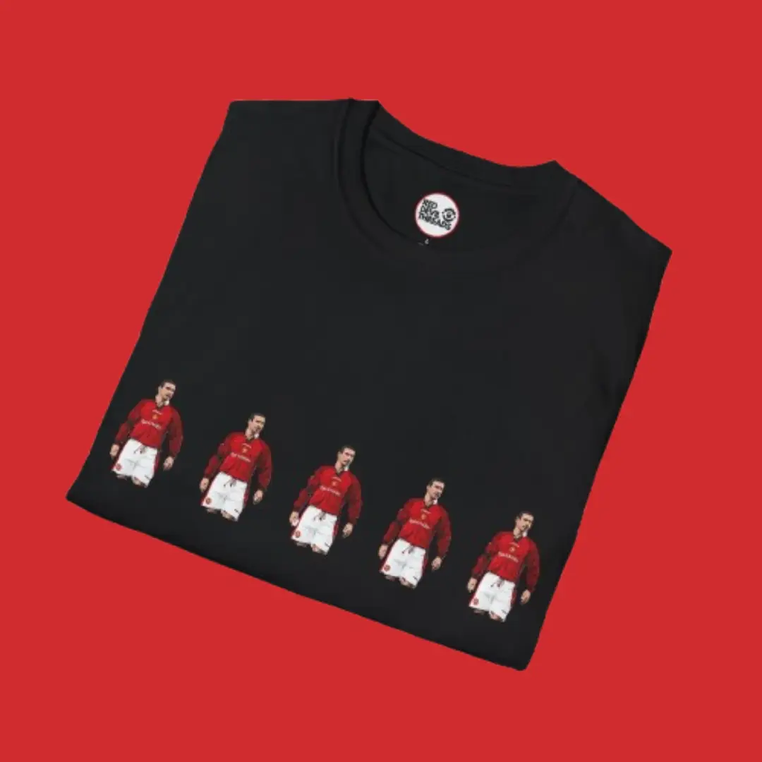 Close-up of the "5 Cantona’s" design on a black T-shirt, a tribute to Manchester United’s legendary Stretford End chant.