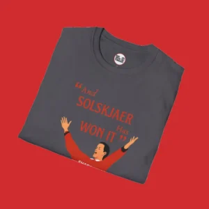 Close up version of Manchester United T-shirt featuring Ole Gunnar Solskjaer celebrating his 1999 Champions League winning goal, with the quote "AND SOLSKJAER HAS WON IT".